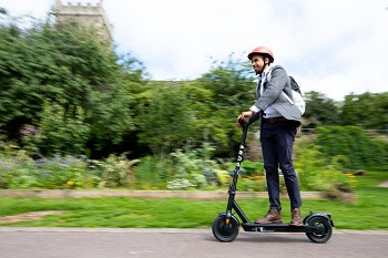 Man on an Electric Scooter in the countryside 