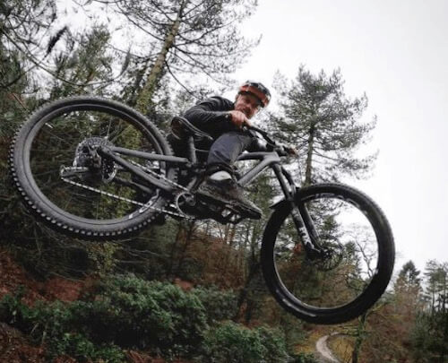 Leisure Lakes Bikes promotion codes image - man is doing a bike jump