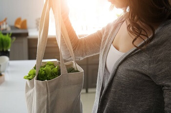 Woman Holding Sustainable Shopping Bag 