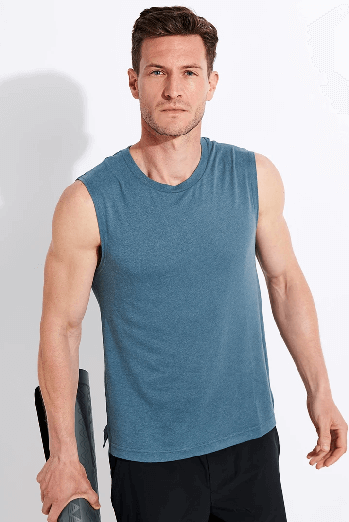 Man in a blue The Sports Edit Yoga vest 